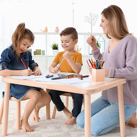 Nanny providing attentive childcare in a family setting